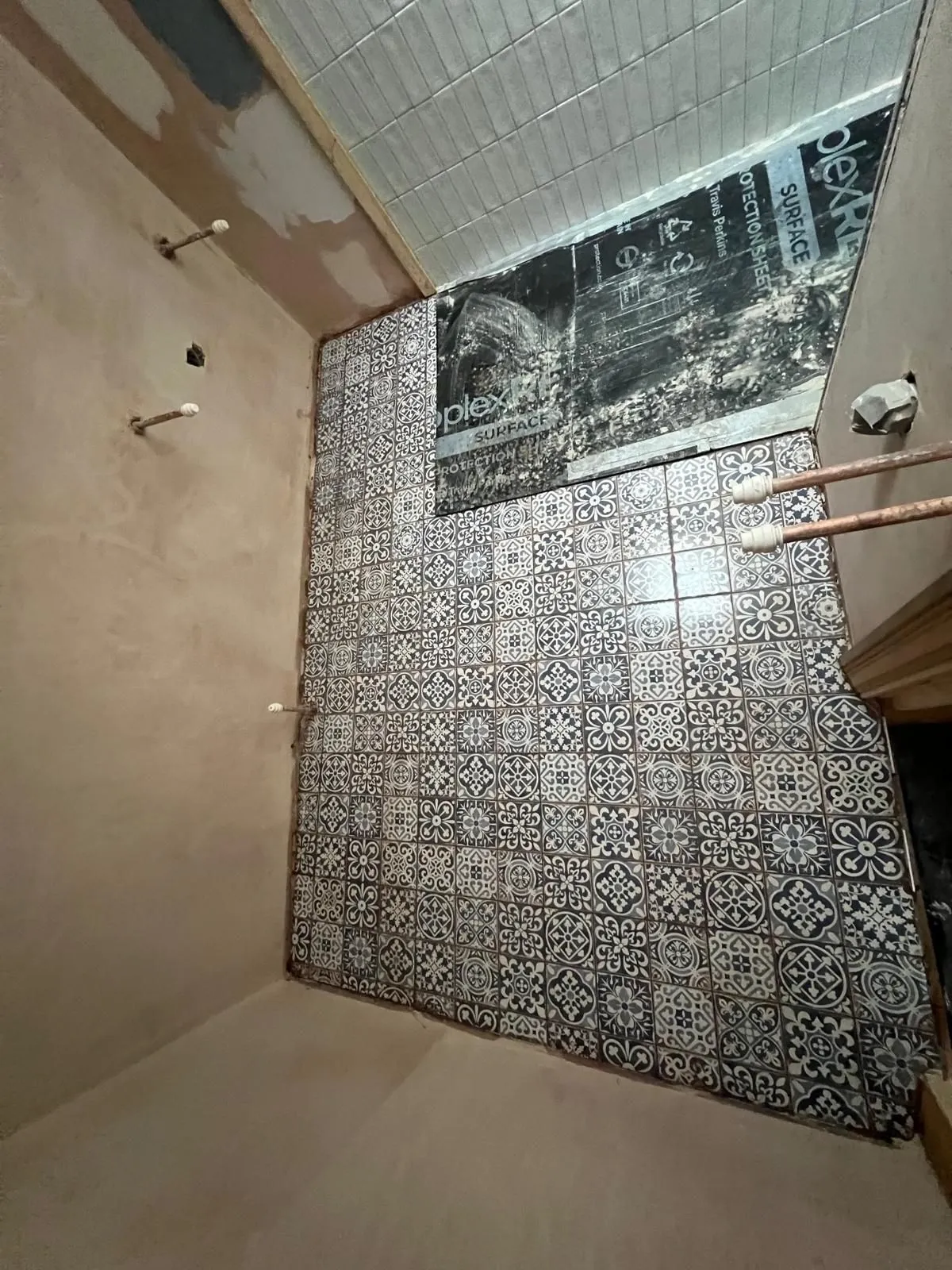 Blue patterned encaustic-style bathroom floor